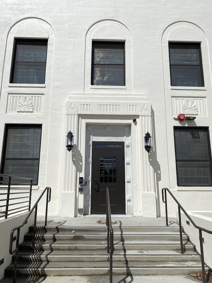 Restored and renovated main entrance to Building 205, featuring widened stairs and added accessibility ramps 